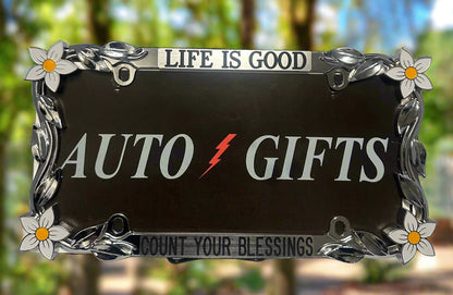 A chrome frame featuring hand painted daisy flowers with life Is Good Count Your Blessings