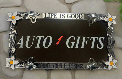 A chrome frame featuring hand painted daisy flowers with life Is Good Count Your Blessings